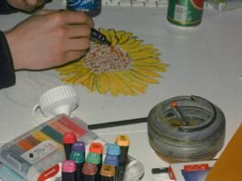 colorful mixed media art supplies, including paints, papers, and found objects for diy projects